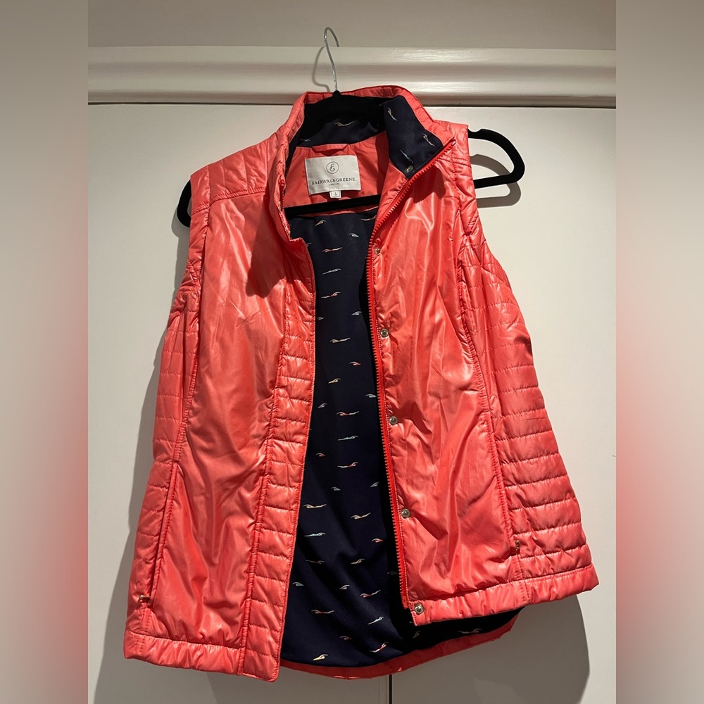 Ladies coral/ orange Fairway & Greene golf vest. Navy lining. Size small.
